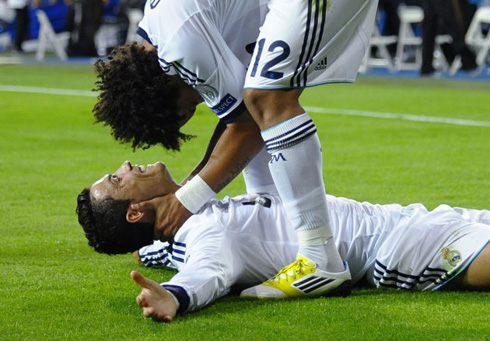 Marcelo holding Cristiano Ronaldo head as they both celebrate Real Madrid 3-2 win against Manchester City, in the UEFA Champions League 2012-2013