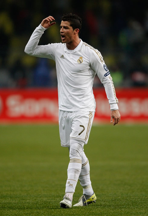 Cristiano Ronaldo complaining at something and wearing the all-white Real Madrid jersey/shirt, without the bwin sponsoring name/logo