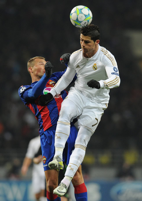 Cristiano Ronaldo jumping more than his opponent and heading the ball in a UEFA Champions League match in 2012