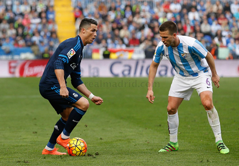 Cristiano Ronaldo taking on a defender in Real Madrid's vist to Malaga