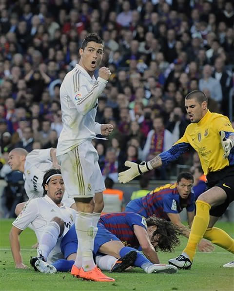 Cristiano Ronaldo celebrating Sami Khedira goal, as he looks to his side to confirm there was no offside being ruled, in Barcelona 1-2 Real Madrid