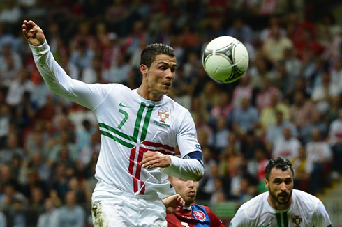 Cristiano Ronaldo looking at the ball, as Hugo Almeida seeks an opportunity to help him, in the EURO 2012 quarter-finals game between Portugal and the Czech Republic
