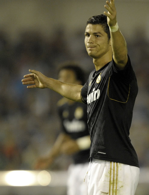 Cristiano Ronaldo calling for someone's attention in Racing Santander vs Real Madrid, La Liga match in 2011-2012
