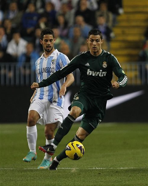 Cristiano Ronaldo and Isco, playing against each other in Malaga vs Real Madrid, for the Spanish League 2012-2013