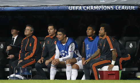 Cristiano Ronaldo sitting on the bench, next to Casemiro and Marcelo