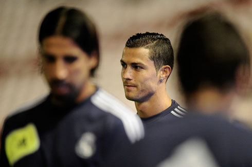 Cristiano Ronaldo looking happy as gets photographed behind Khedira, in Real Madrid 2012-2013