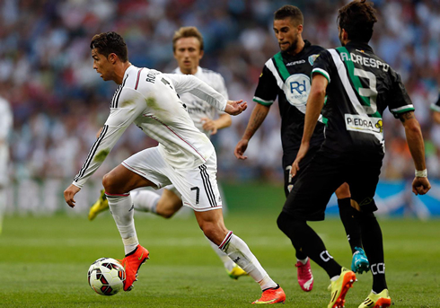 Cristiano Ronaldo runnign with the ball glued to his right boot