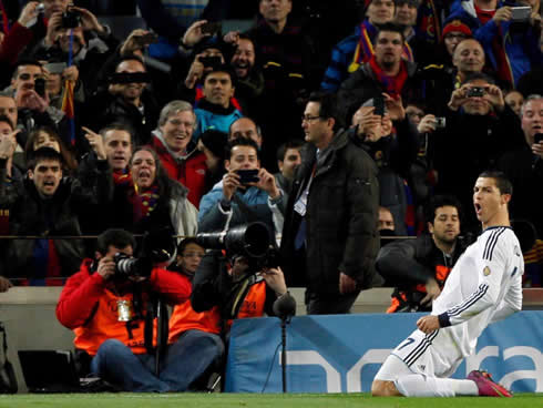 Cristiano Ronaldo sliding on his knees in the Camp Nou, while Barcelona fans take photos and insult him at the same time, in Copa del Rey 2013
