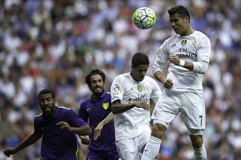 Cristiano Ronaldo heading higher than Varane to head a cross from a corner-kick