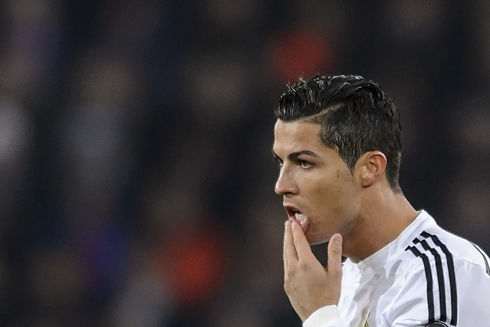 Cristiano Ronaldo pressing his lips with his left hand