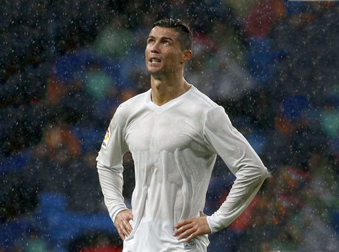 Cristiano Ronaldo in a completely wet white uniform