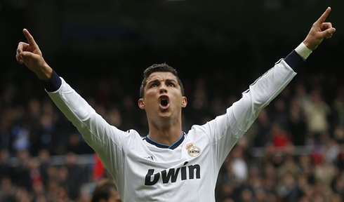 Cristiano Ronaldo raising his two arms in the air, to celebrate his perfect hat-trick with Real Madrid against Getafe, in La Liga 2013