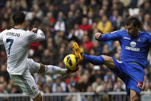 Cristiano Ronaldo left foot shot being blocked by a Getafe defender, in a game for Real Madrid in 2013