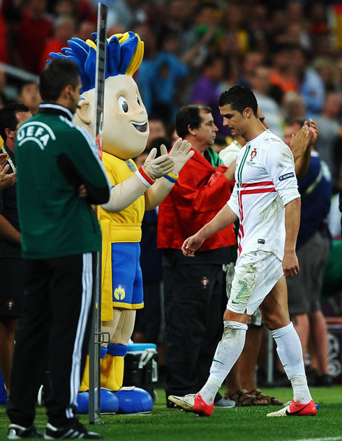 Cristiano Ronaldo walking away from the pitch sad, in Portugal vs Spain for the EURO 2012 semi-finals