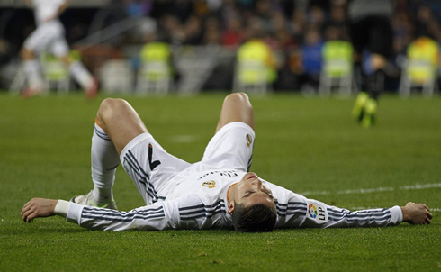 Cristiano Ronaldo completely exhausted and lied down on the ground