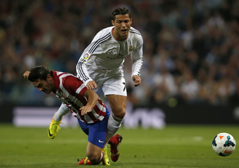 Cristiano Ronaldo being fouled by an Atletico Madrid defender