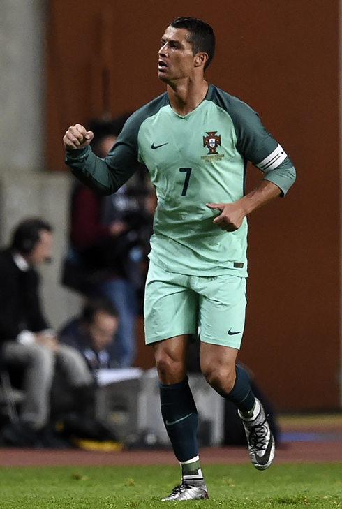 Cristiano Ronaldo closes his hand to celebrate his goal for Portugal in March of 2016