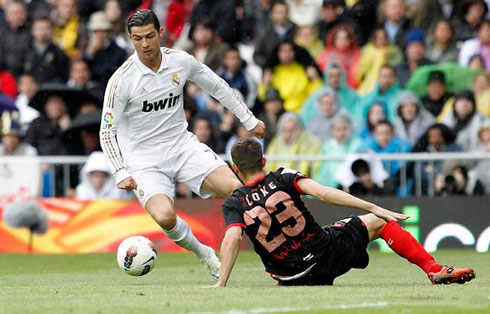 Cristiano Ronaldo sitting down a defender after a great dribble in Real Madrid vs Sevilla, for the Spanish League in 2012