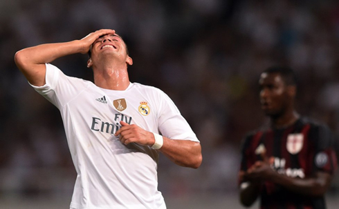 Cristiano Ronaldo holding his forehead with his right hand