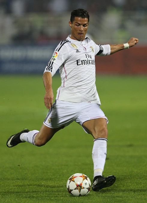 Cristiano Ronaldo shooting the ball in a game between Real Madrid and AC Milan