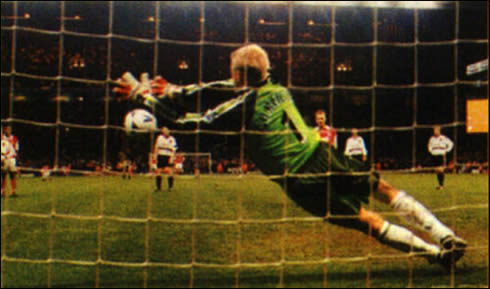 Peter Schmeichel stopping and saving a penalty kick against Arsenal