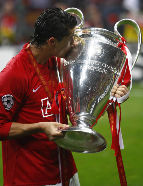 Cristiano Ronaldo kissing the UEFA Champions League trophy, after winning it for Manchester United in 2008