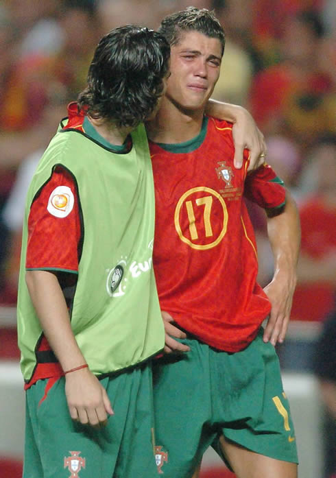 Cristiano Ronaldo crying and being comforted by Tiago, in the EURO 2004 final