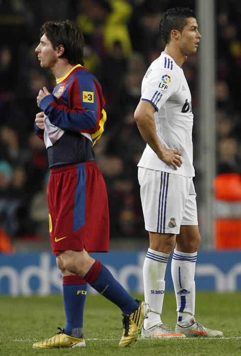 Cristiano Ronaldo and Lionel Messi turning their backs at each other, in a Barcelona vs Real Madrid Clasico
