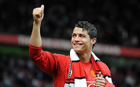 Cristiano Ronaldo greeting fans at Old Trafford, with his thumb up, while being a Manchester United star player