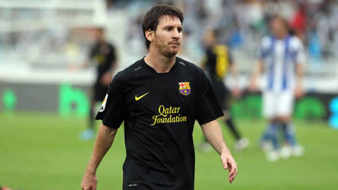 Lionel Messi in a Barcelona black jersey in 2012