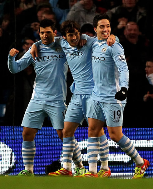 Sergio Kun Aguero celebrating a goal with David Silva and Samir Nasri, in Manchester City 2011-2012