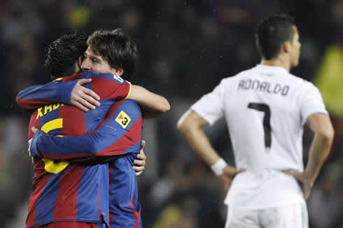 Cristiano Ronaldo crying, as Xavi and Lionel Messi hug each other while celebrating another goal for Barcelona against Real Madrid
