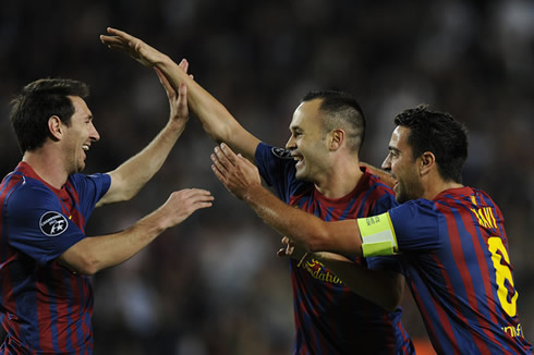 Lionel Messi, Messi and Xavi all smiling, celebrating a goal in Barcelona, in 2012