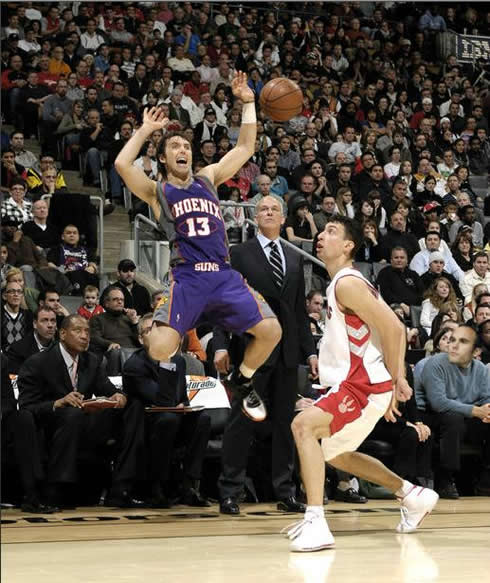 Steve Nash flying and falling behind, at a Phoenix Suns game in 2012
