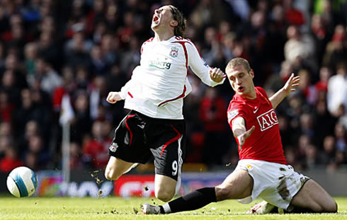 Nemanja Vidic making a great tackle at Fernando Torres, in Manchester United vs Liverpool