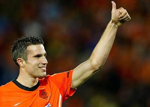 Robin van Persie raising his left thumb, while playing for the Netherlands, Holland, in 2012
