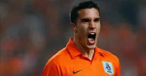 Robin van Persie screaming while playing for Holland, Netherlands, in an orange jersey/shirt and uniform kit in 2012