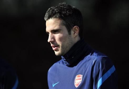Robin van Persie in training for Arsenal, wearing a blue jacket