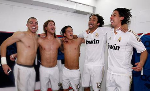 Pepe, Sergio Ramos, Ozil, Marcelo and Khedira, jumping in Real Madrid locker room celebrating La Liga in 2012