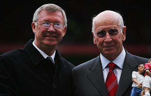 Sir Alex Ferguson and Sir Bobby Charlton, posing for a photo