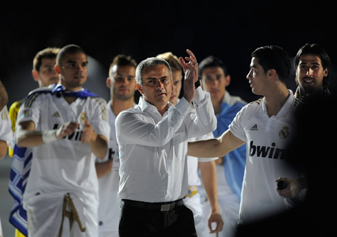 José Mourinho clapping and applauding Real Madrid fans and supporters, at the Santiago Bernabéu, with Ronaldo near him at the end of La Liga, in 2012