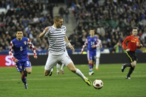 Karim Benzema in action for France and wearing the new French National Team jersey, kit and uniform, with blue stripes, in 2012