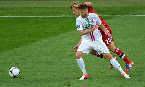 Miguel Veloso in a defensive action for Portugal, in the EURO 2012