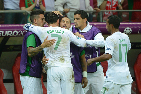 Cristiano Ronaldo hugging Miguel Lopes and Ricardo Quaresma, as Ricardo Costa and Nani prepare to join them, at the EURO 2012