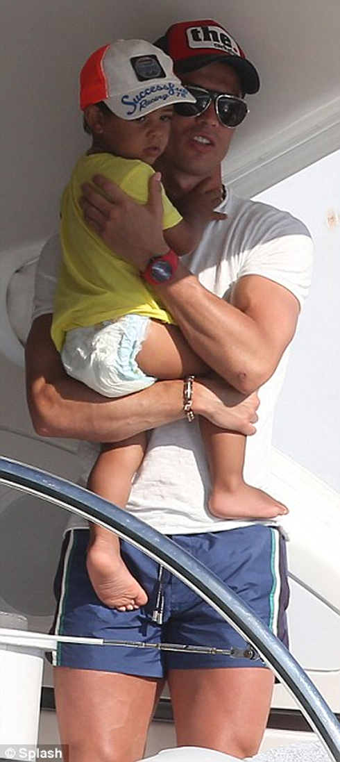 Cristiano Ronaldo holds his son, Cristiano Ronaldo Jr, on his yacht, in Saint Tropez 2012