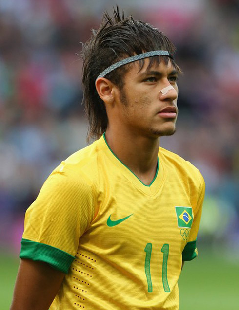 Neymar wearing a headband to hold his hair and show his new haircut for 2012-2013