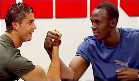 Cristiano Ronaldo doing an arm wrestling with Usain Bolt, in 2009, just after he signed and joined Real Madrid