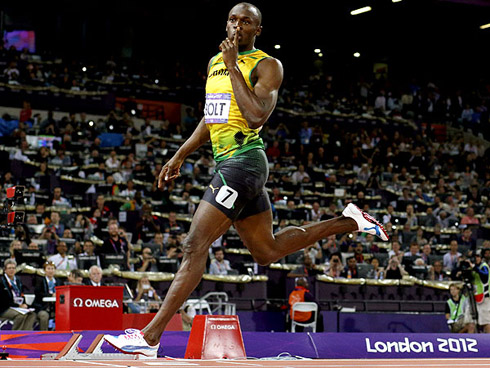 Usain Bolt demanding silence as he finishes his 100m run, in the 2012 London Olympics games