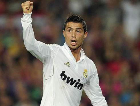Cristiano Ronaldo raising his hand after a goal was scored, in a Real Madrid game in 2012