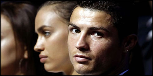 Cristiano Ronaldo looking at the cameras, with Irina Shayk next to him, at the UEFA Best Player in Europe awards ceremony, in 2012